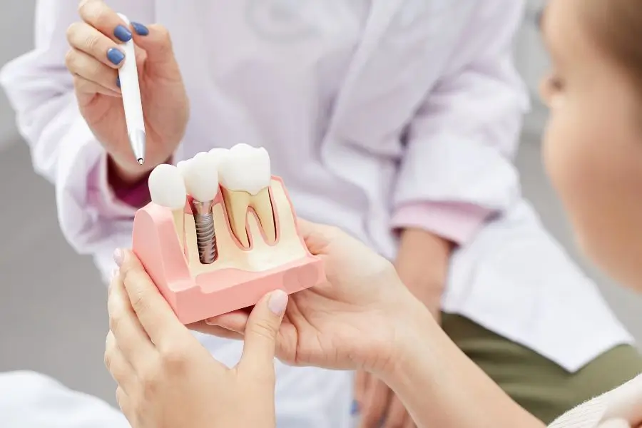 gum-inflammation-young-womans-face-with-doctor-gloved-hand-her-jaw-showing-red-bleeding-gums_407348-1549